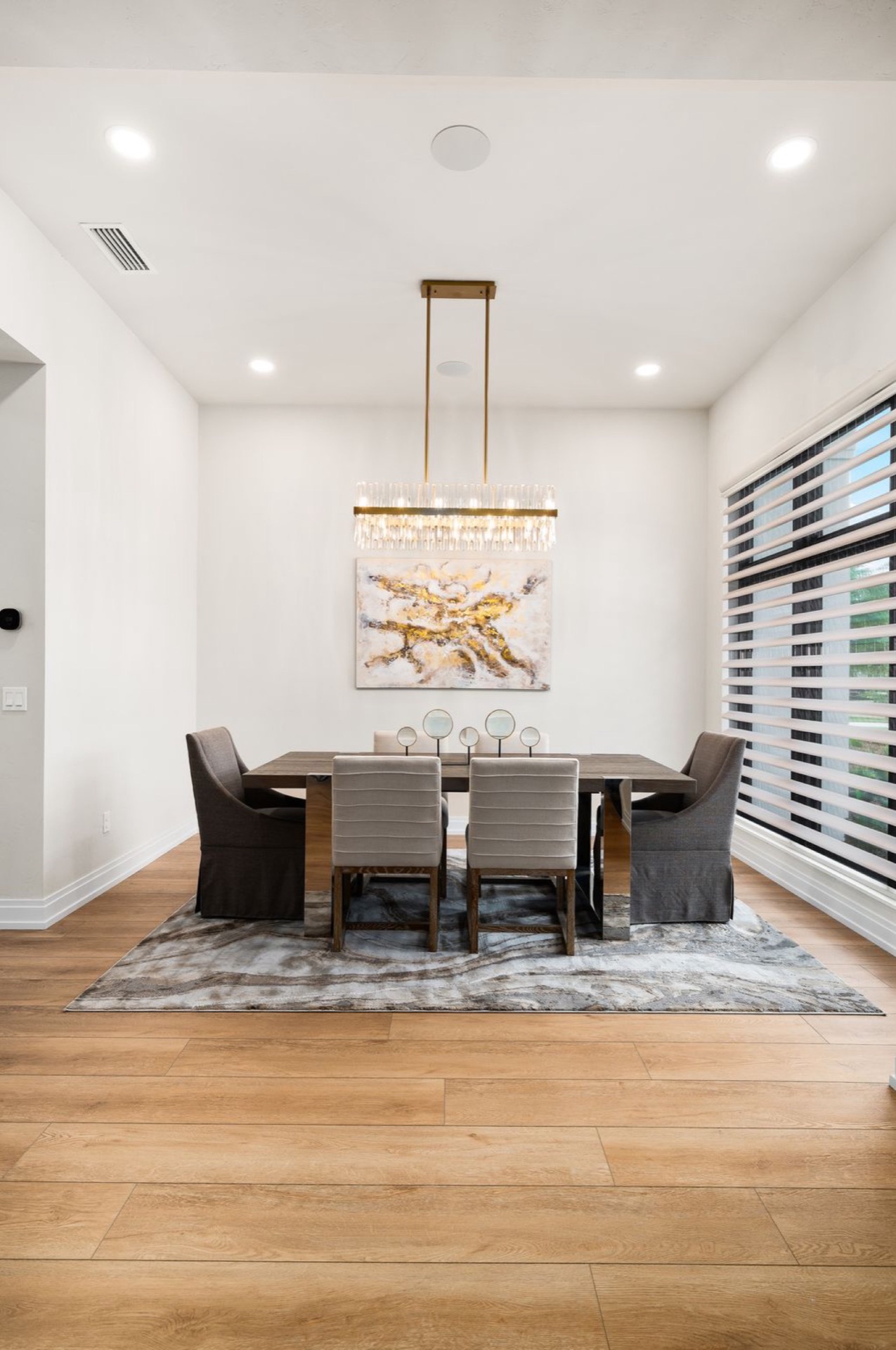 Wired motorized sheer shades in a custom dining room